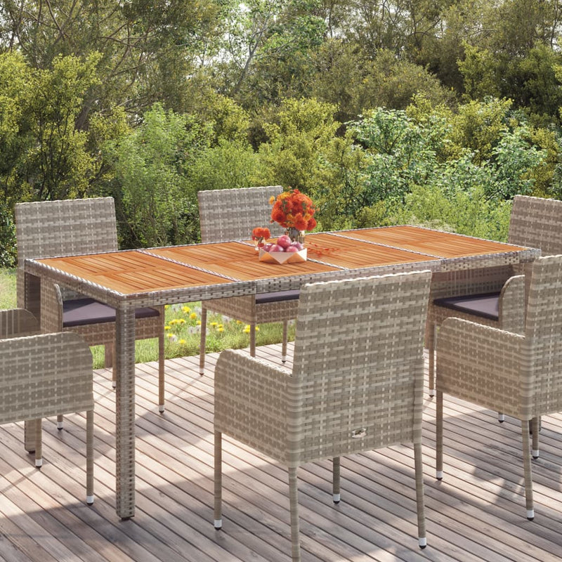 Table de jardin élégant en résine tressée avec dessus en verre