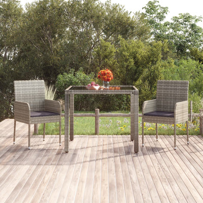 Table de jardin en résine tressée avec dessus en verre noir